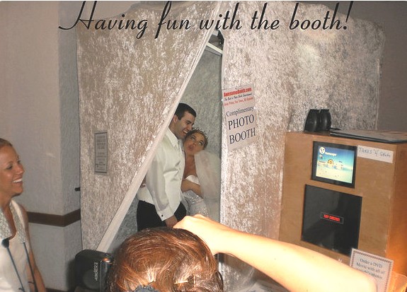 bride groom in photo booth rental detroit toledo ann arbor wedding having fun